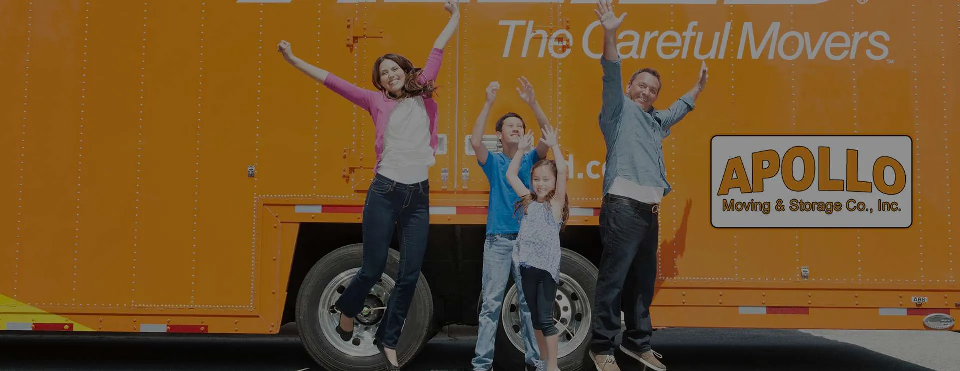 Family celebrating in front of their Allied Van Lines moving truck