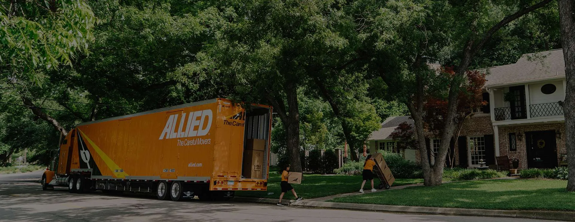 Allied Van Lines moving van arriving on a residential street