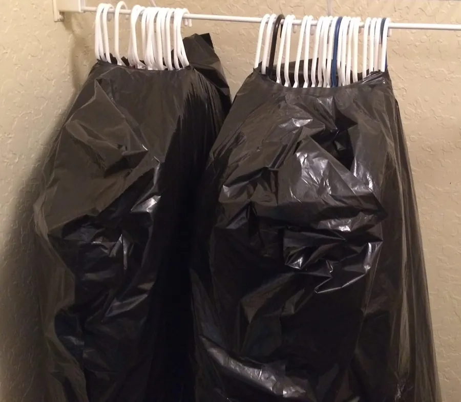 Clothes on hangers ready for a wardrobe carton